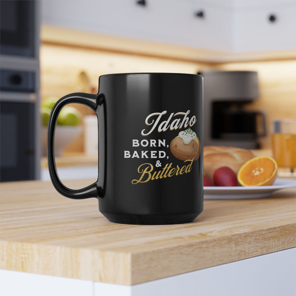 Idaho Born, Baked & Buttered Coffee Mug — Black Ceramic Tea Cup (15oz)